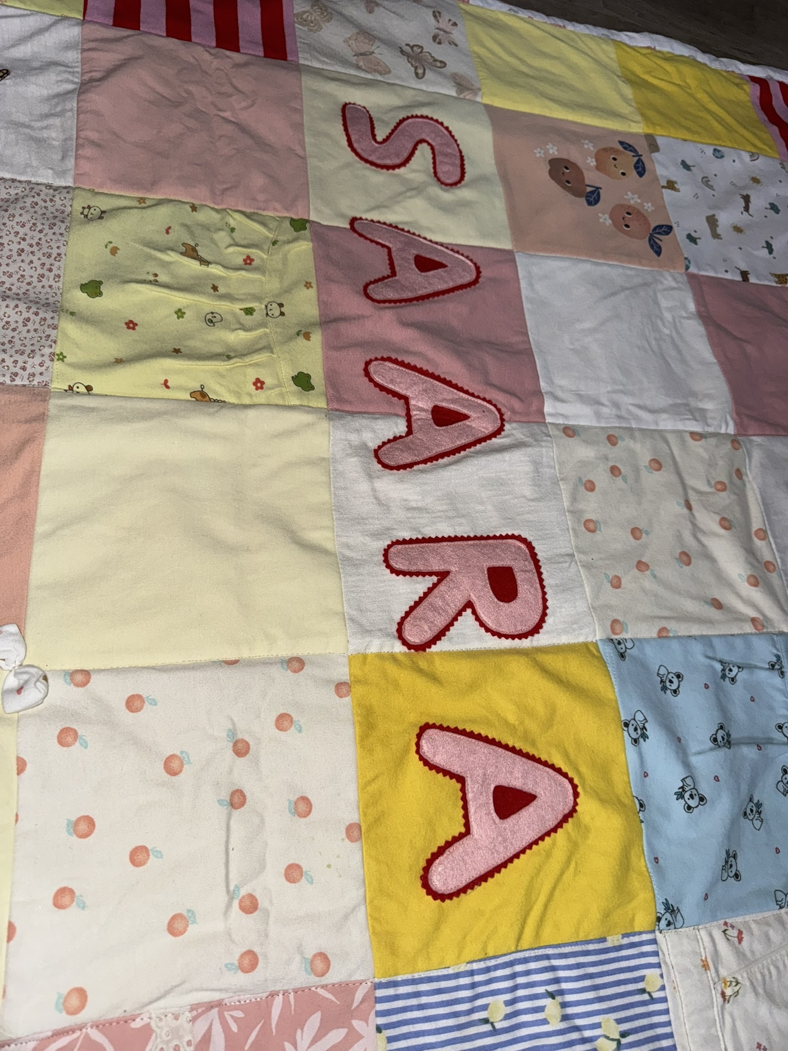 Saara's name stitched across the keepsake blanket