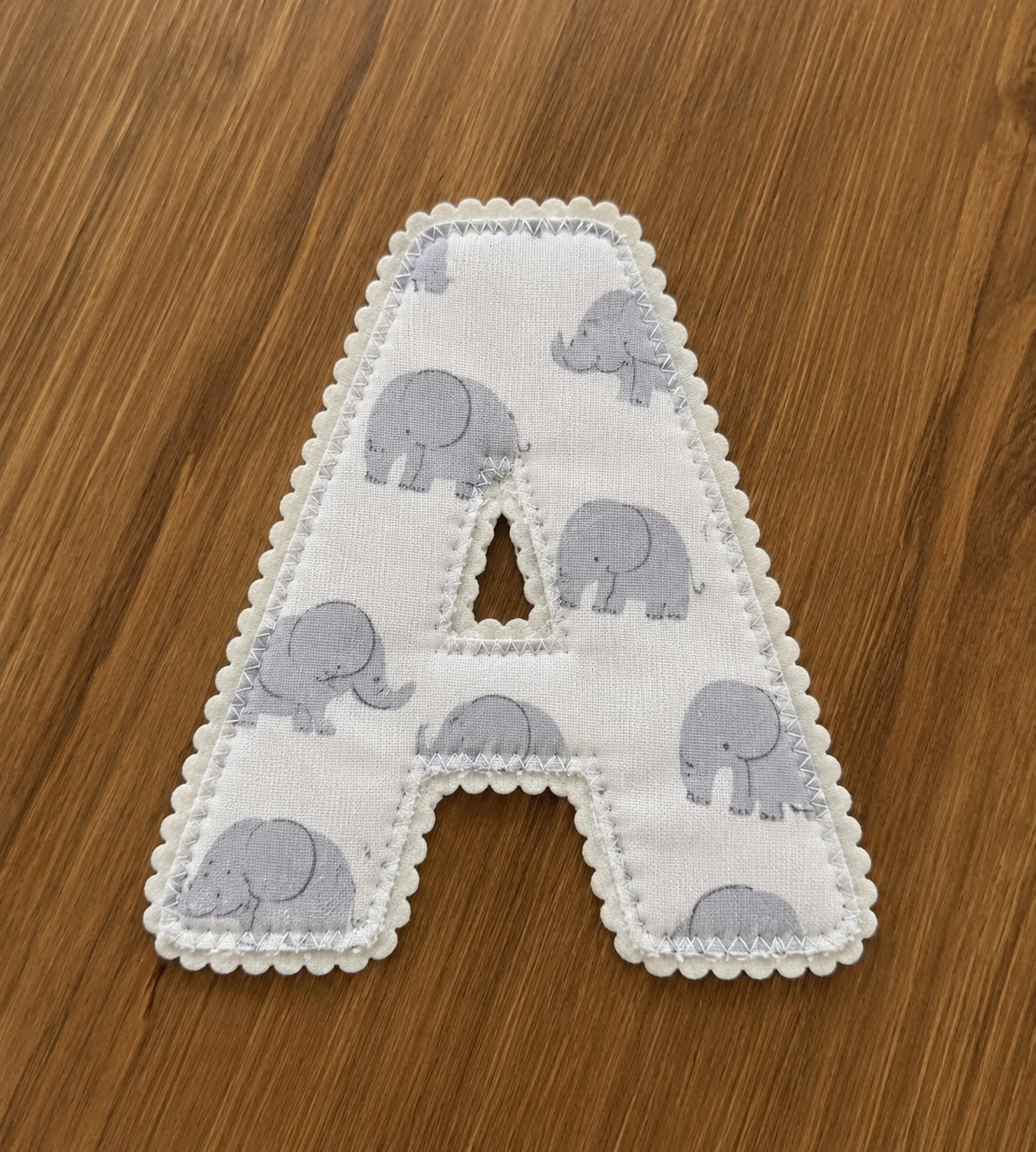 A fabric letter appliqué made by Sukhjyot Crafts