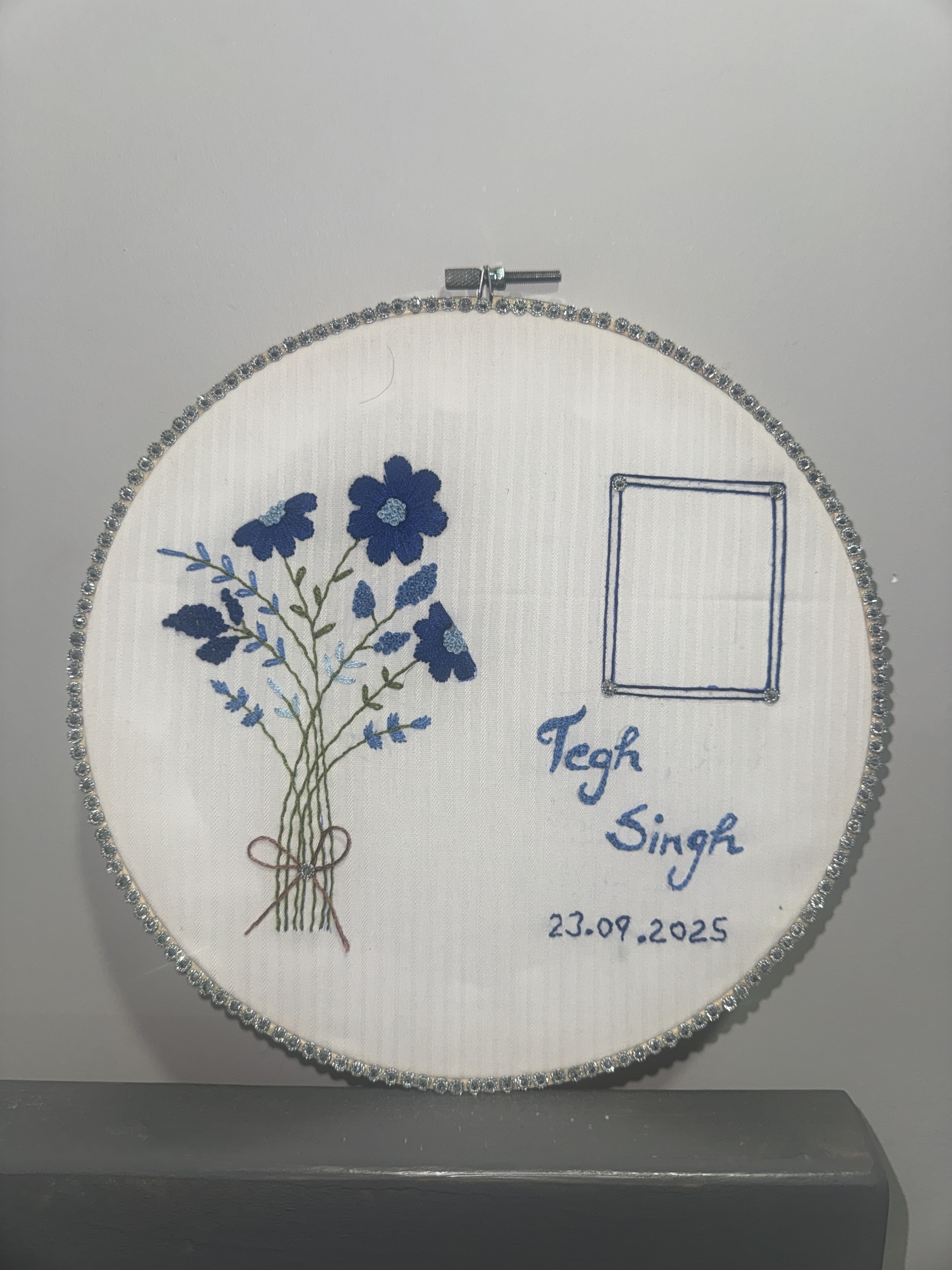 Personalised floral hoop displayed on a shelf