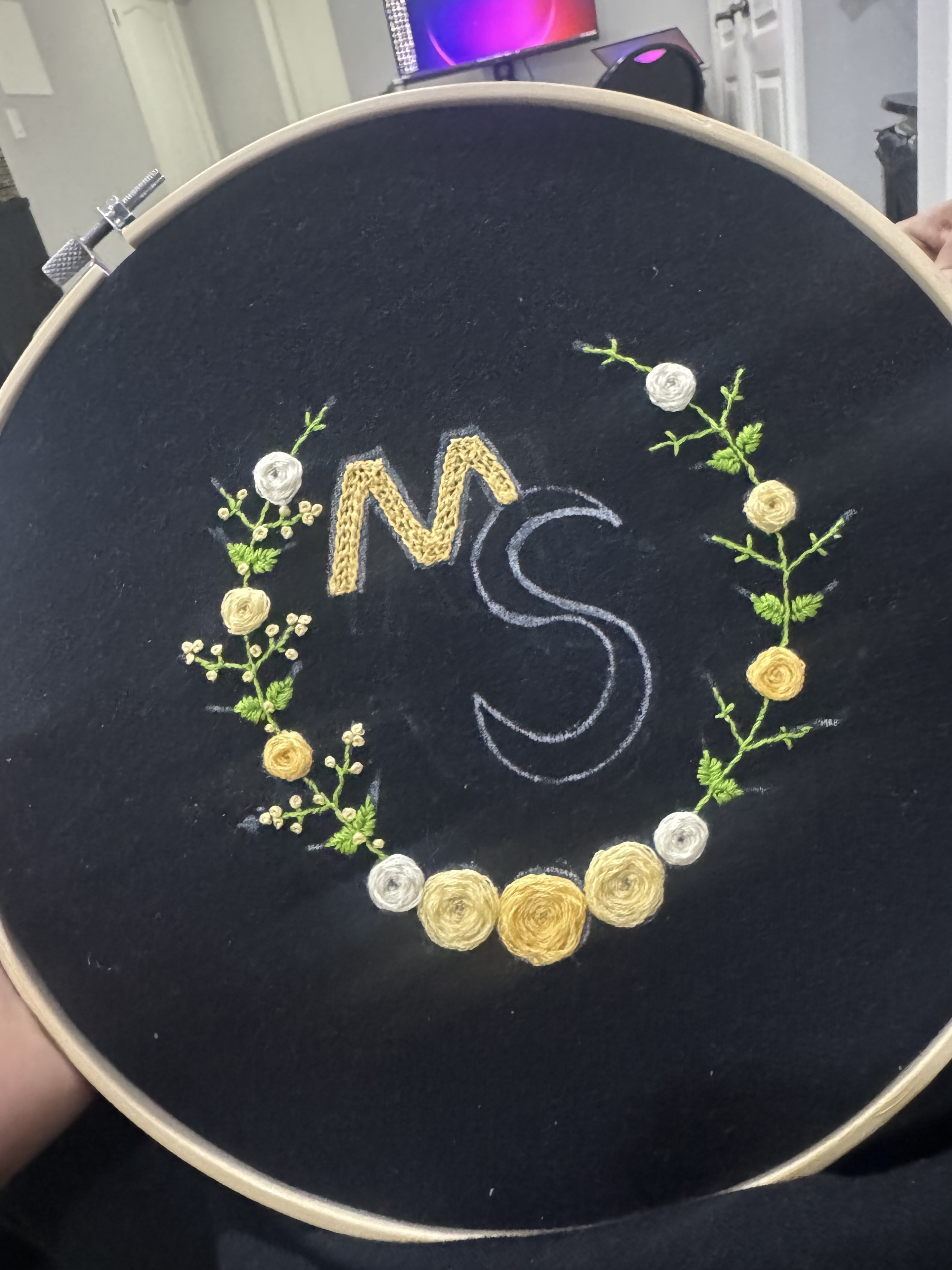 Dark fabric monogram hoop with floral embroidery
